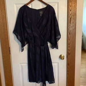 Adrianna Papell navy blue flutter sleeve dress.